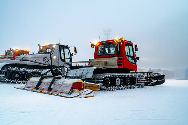 istock Snow groomers on ski slopes during a winter morning 2208084385