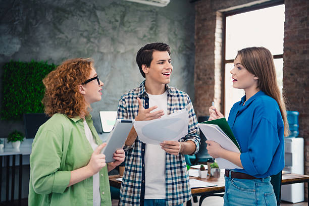 istock A group of young professionals having an engaging discussion in a modern coworking space, collaborating on tasks 2208084575