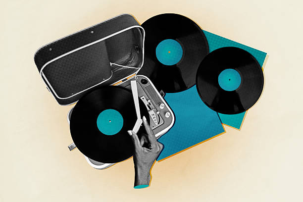 Record player on top of  a stack of vinyl LP (Long Play) records.