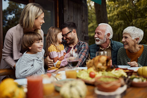 istock Happy extended family enjoying during lunch on a terrace. 2208086080
