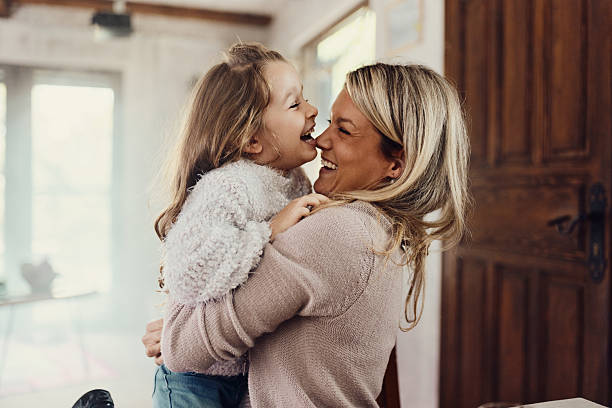 istock Cheerful single mother and daughter having fun at home. 2208086895