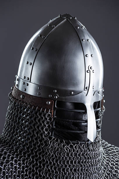 istock Simple Medieval Knight's Nasal Helmet with Chainmail. Classic head protection featuring a central nose guard and attached chainmail collar. 2208088840