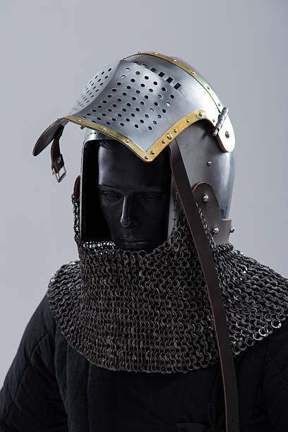 istock Steel Bascinet with Open Visor. Medieval helmet featuring brass accents and chainmail protection. 2208089601