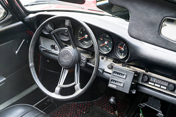 Porsche 912 Targa classic sports car interior and dashboard. The 912 is an entry-level variant of the 911. The car is parked on the street in Zwolle during a sunny summer morning.