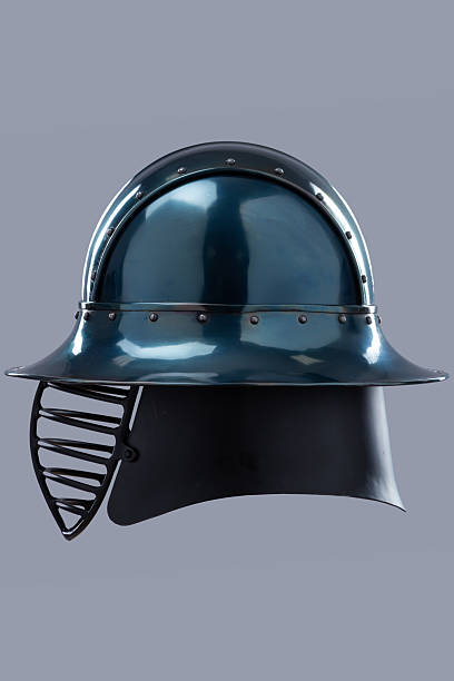 Dark Metal Helmet with Wide Brim and Grill Visor. This image shows a dark, possibly gunmetal grey, helmet with a wide, slightly sloping brim and a black grill-like visor covering the face.