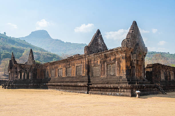 istock Wat Phou, Laos, large, ancient stone building set against a clear blue sky background 2208091587
