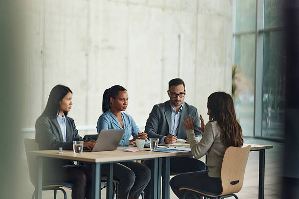 istock Business team talking to a candidate on job interview in the office. 2208093318