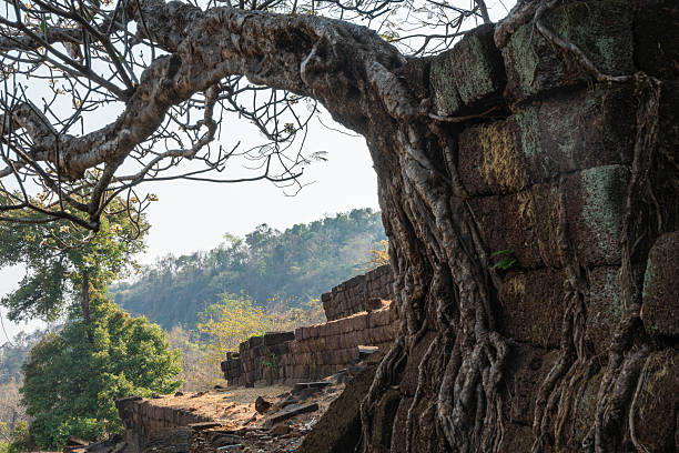 istock Wat Phou, Laos, large, ancient stone building set against a clear blue sky background 2208094078
