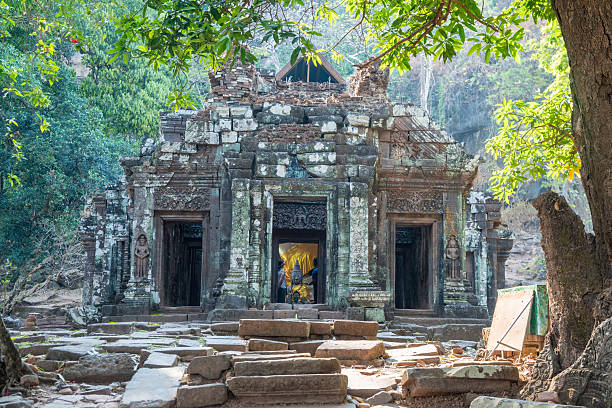 istock Wat Phou, Laos, large, ancient stone building set against a clear blue sky background 2208094159