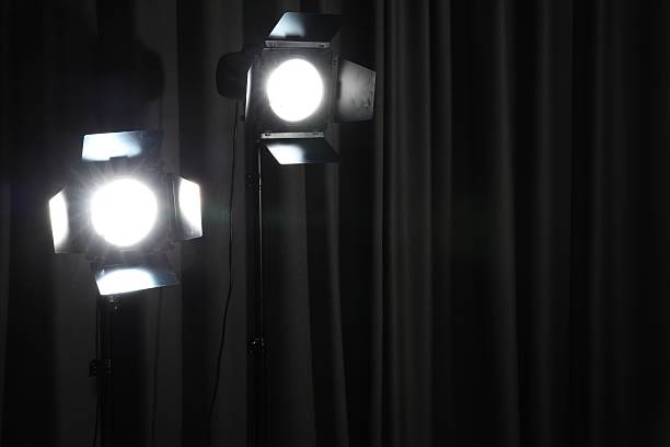 istock Professional spotlights against dark curtain. Space for text 2208094351
