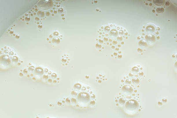 istock Macro milk texture,macro milk texture,White surface of milk and bubbles and ripples from above birds eye view 2208095197