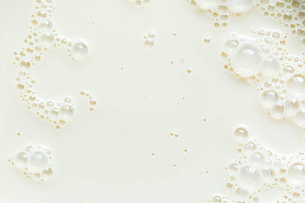 istock Macro milk texture,macro milk texture,White surface of milk and bubbles and ripples from above birds eye view 2208095221