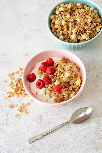 istock Granola with Yogurt and Raspberries Healthy and Delicious Breakfast vertical 2208096285