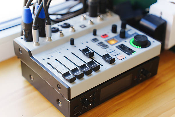istock Recording equipment setup with mixer and audio interface near window 2208098280