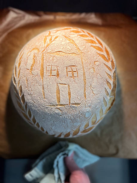 Artisan Bread Featuring Unique House Design and Intricate Flour Patterns for Aesthetic Appeal