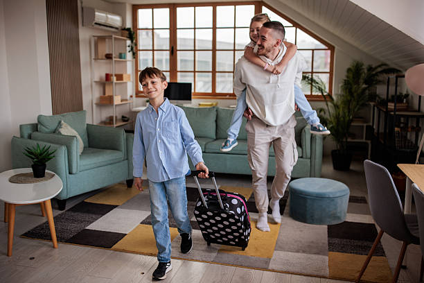 istock Uncle, niece and nephew preparing for a trip together 2208103162
