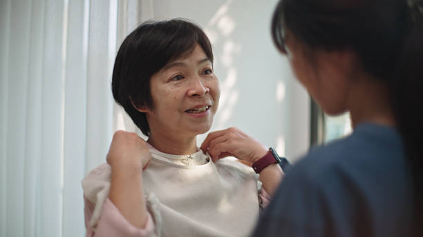 istock Teenager dressing up her mother. 2208104209