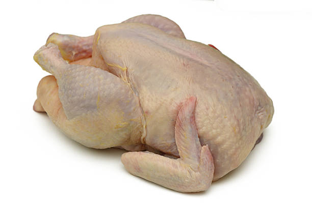 istock Freshly prepared whole chicken ready for culinary adventures in the kitchen during a lively family gathering 2208104911