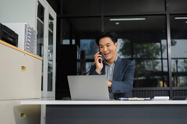 istock Mature businessman calculate and analyzing graph document financial with report and laptop in office. 2208106285