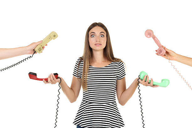 istock Young woman and two hands with handsets on white background 2208107820