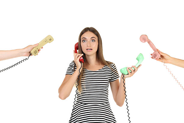 istock Young woman and two hands with handsets on white background 2208109165