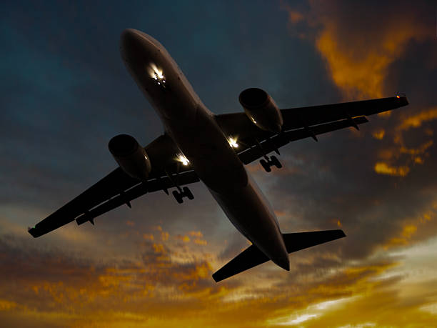 istock Airplane taking off over the city at sunset. 2208124879