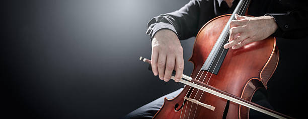 istock Cello player cellist performing in an orchestra background 2208130435