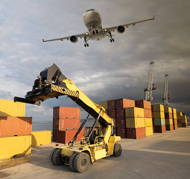 istock Airplane flying over the international container port 2208130669