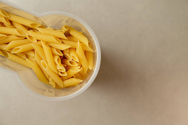 istock Pasta in a clear container awaiting a delicious meal preparation 2208131649