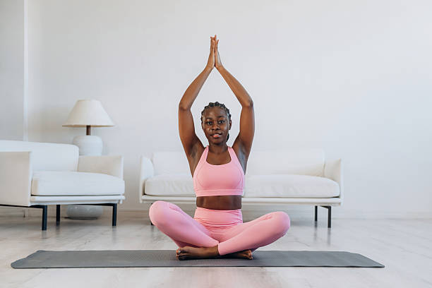 istock Woman is doing yoga at home 2208132443