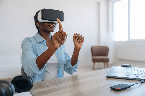 istock Testing virtual reality headset. Woman is at home in domestic room 2208134055