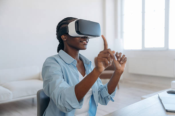 istock Testing virtual reality headset. Woman is at home in domestic room 2208134062