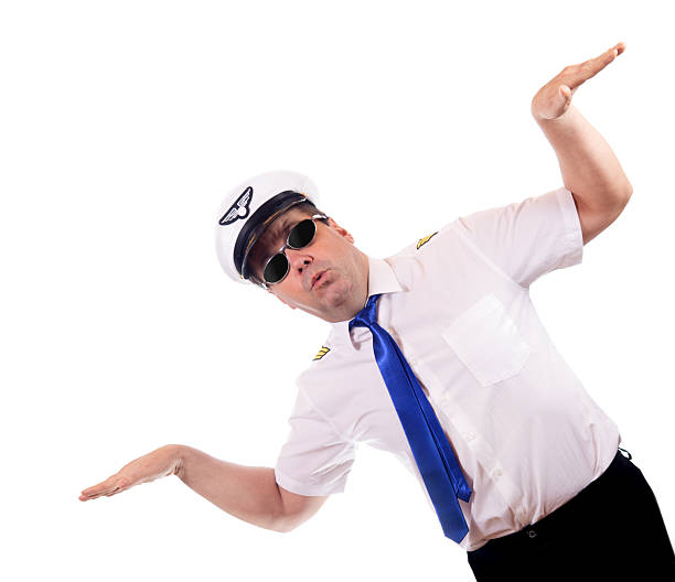 istock Happy laughing pilot in uniform gesturing flight isolated on white background. Captain of air plane with white shirt uniform. 2208134650