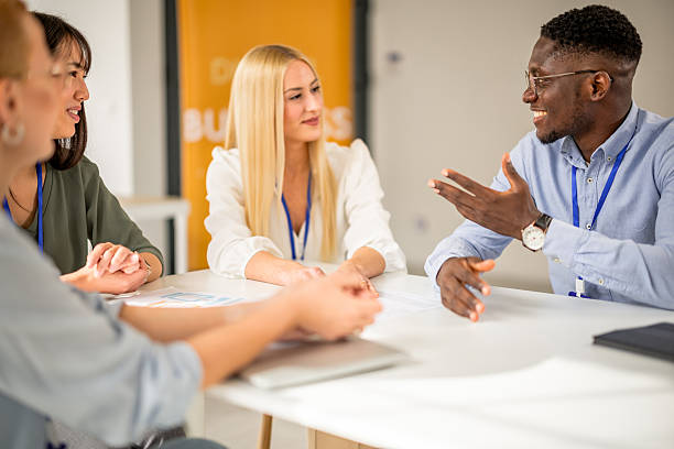 istock Business professionals engage in discussions during an educational conference at a convention center 2208135350