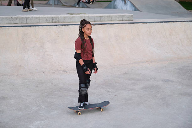 istock Young skater standing on skateboard in skate park 2208136963