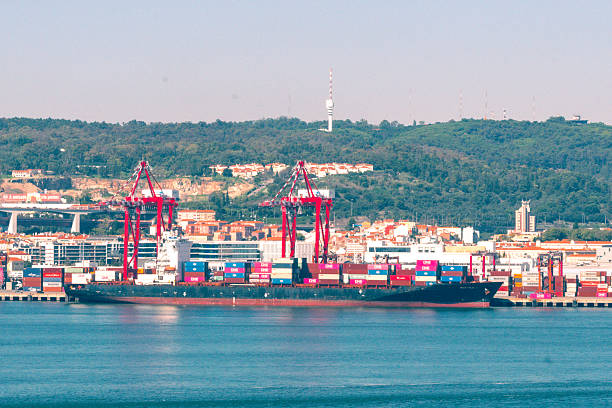 Port of Lisbon, Lisbon, Portugal - October 23, 2024 - The Seattle C container ship unloading at the Port of Lisbon on the Tagus River.