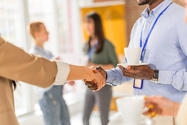 istock Business professionals networking during a conference at a convention center with a focus on collaboration and learning 2208137148