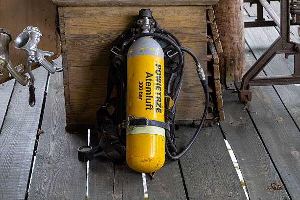 oxygen bottles, fins and diving equipment on a fast moving motorboat