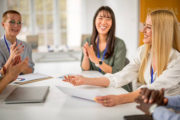 istock Collaborative discussions and engagement at a business conference held at a convention center 2208137413
