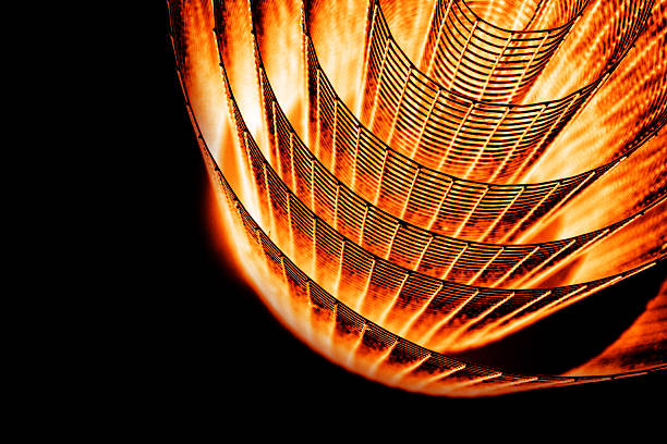 istock Abstract spiral with glowing red and orange tones and wire texture against a black background, symbolizing energy, motion, industrial and futuristic design concepts. Copy space 2208137931