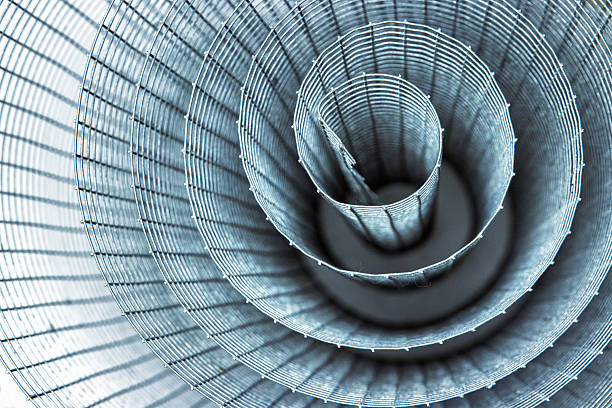 istock Abstract spiral metal coiled wire mesh with grid pattern, geometric symmetry, modern minimal design for industrial construction, diy, architectural concepts. Isolated on white background. Copy space 2208137996
