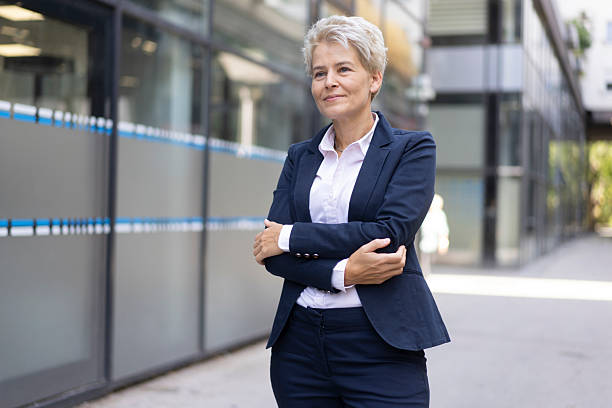 istock Confident Businesswoman Standing in a Modern Urban Setting 2208139951