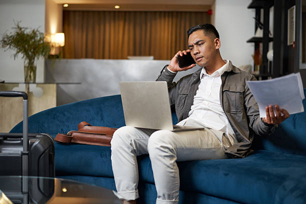 istock Business Professional Working in Hotel Lobby During Travel 2208141338