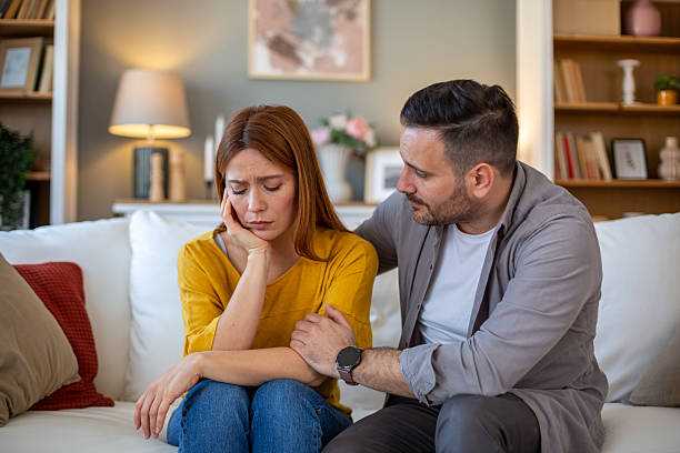 istock Man comforting his sad wife 2208141443