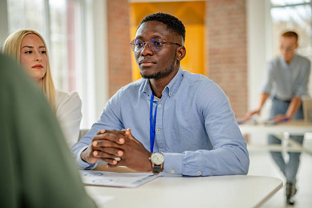 istock Engaging discussions at a business conference held in a convention center with diverse professionals sharing ideas 2208141447