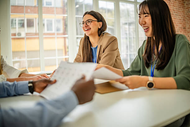 istock Engaging discussions at a vibrant business conference in a modern convention center with diverse professionals collaborating 2208143239