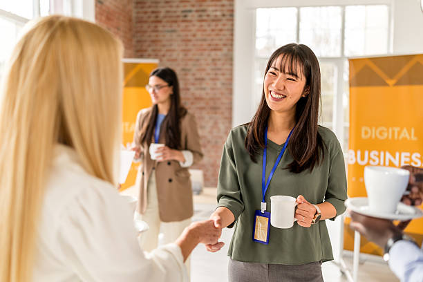 istock Networking and collaboration at a business conference in a modern convention center 2208145637