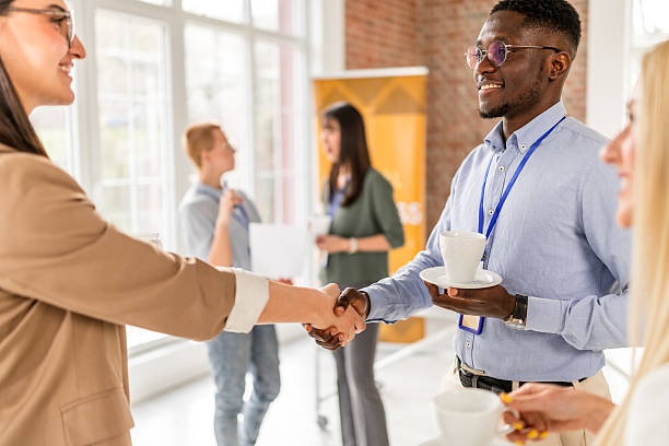 istock Networking and collaboration at a business conference in a modern convention center 2208145874