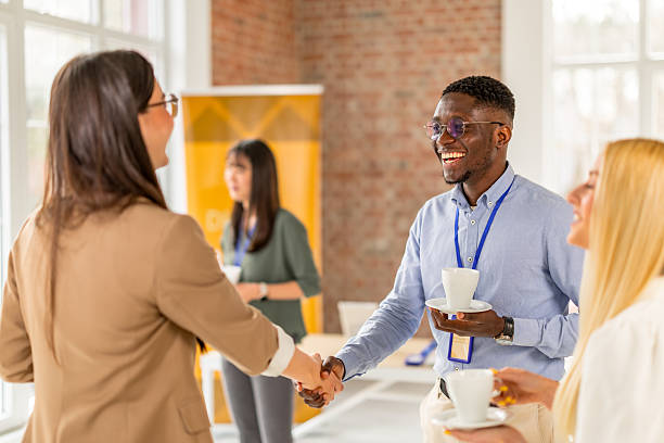 istock Networking and collaboration at a business conference in a modern convention center setting 2208145959