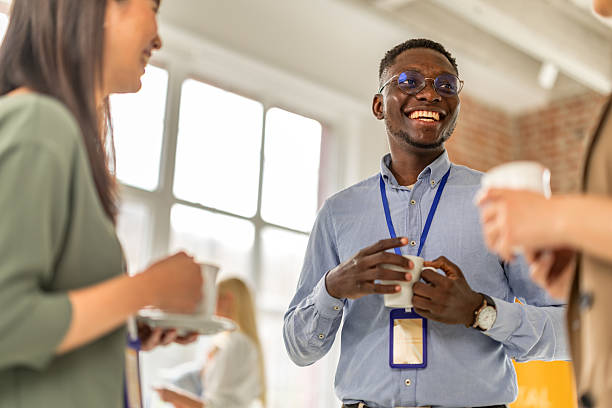 istock Networking and collaboration at a business conference with diverse professionals engaging in discussion 2208146043